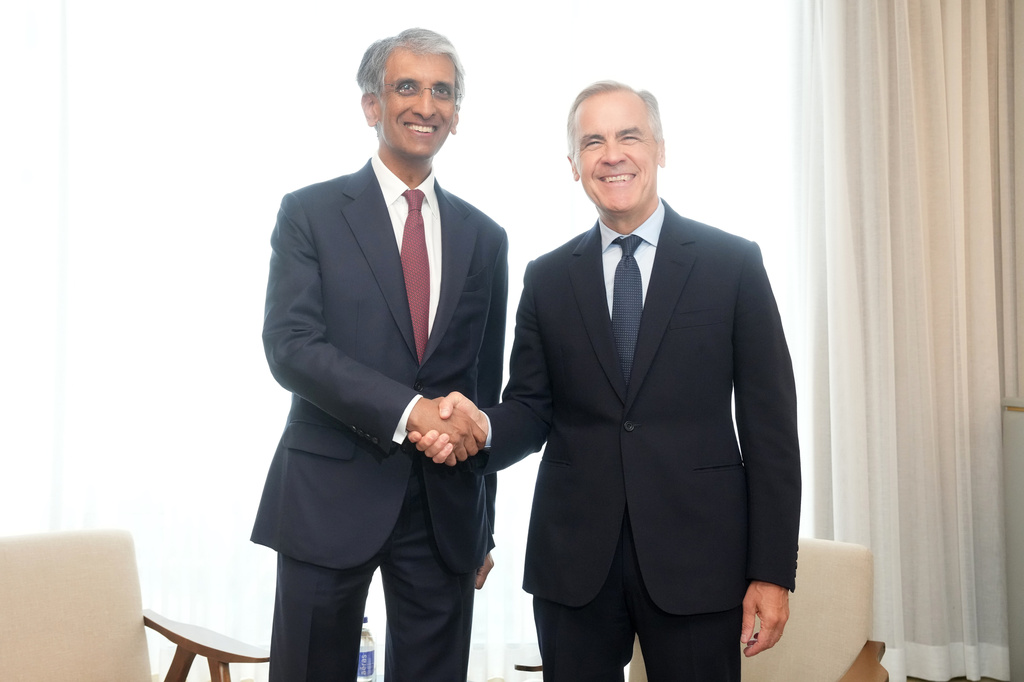 Canada Prime Minister Mark Carney, right, meets Chief Executive Officer of Temasek Holdings Dilhan Pillay in Toronto on Monday, Sept. 14, 2026. (Nathan Denette/The Canadian Press via AP)
