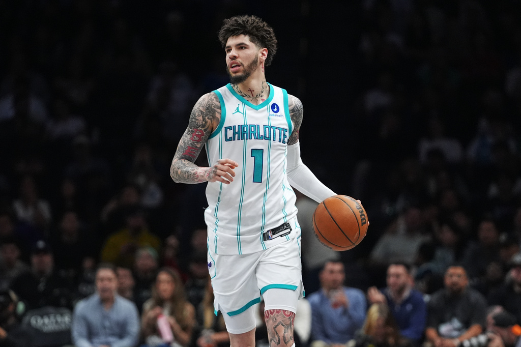 Charlotte Hornets' LaMelo Ball (1) looks to pass during the first half of an NBA basketball game against the Brooklyn Nets Tuesday, March 31, 2026, in New York. (AP Photo/Frank Franklin II)