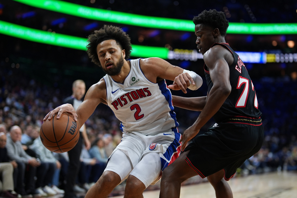 Detroit Pistons' Cade Cunningham, left, tries to get past Philadelphia 76ers' VJ Edgecombe during the first half of an NBA basketball game Sunday, Nov. 9, 2025, in Philadelphia. (AP Photo/Matt Slocum)