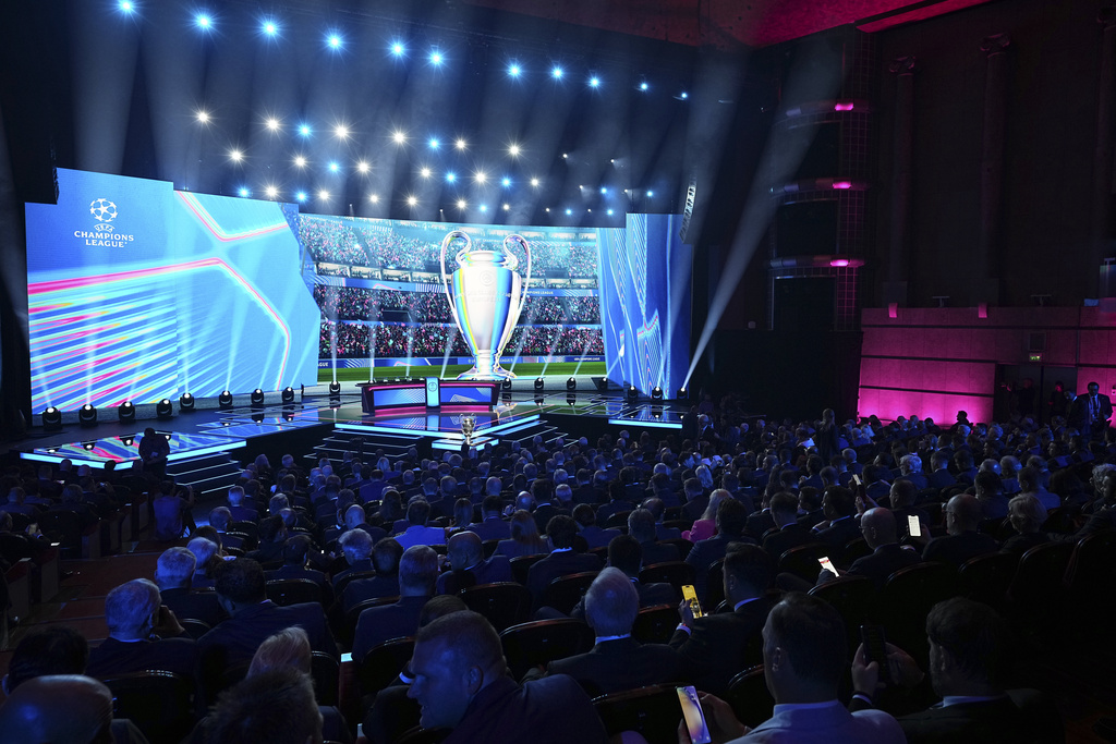 The stage is illuminated before the start of the Champions League soccer league phase draw in Monaco, Thursday, Aug. 28, 2025. (AP Photo/Laurent Cipriani)