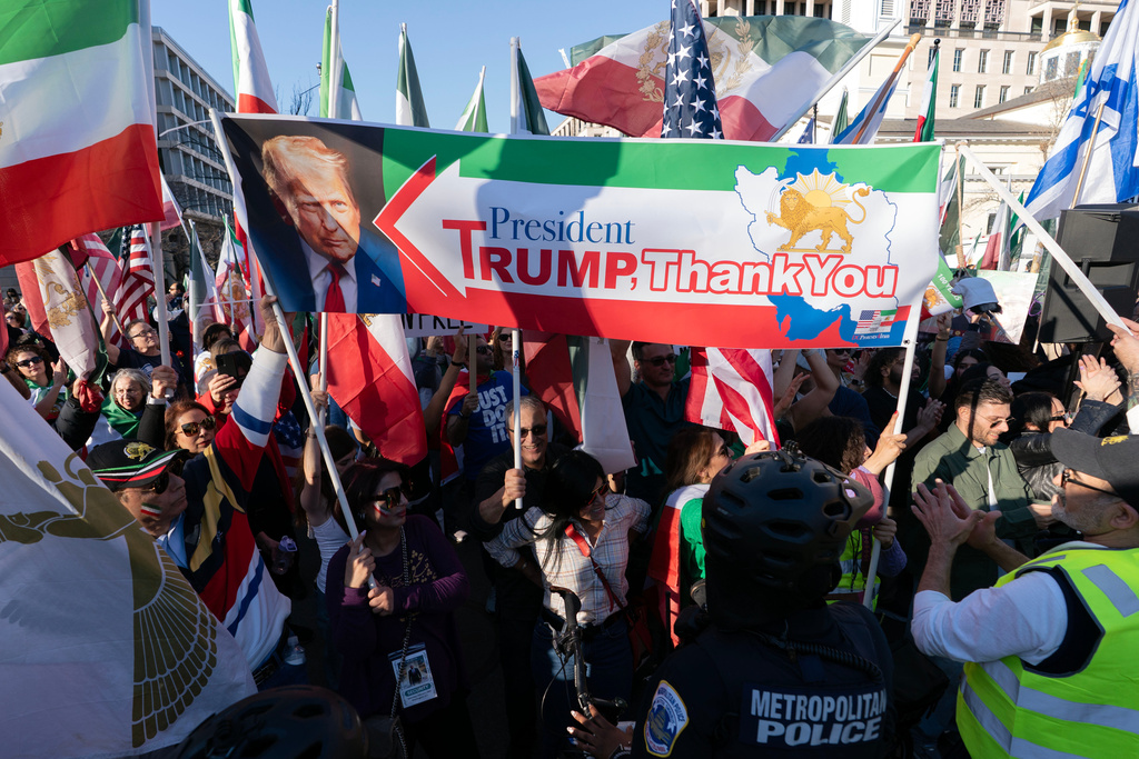 People who support the U.S. and Israel strikes on Iran, rally near the White House, Saturday Feb. 28, 2026, in Washington. (AP Photo/Jose Luis Magana)