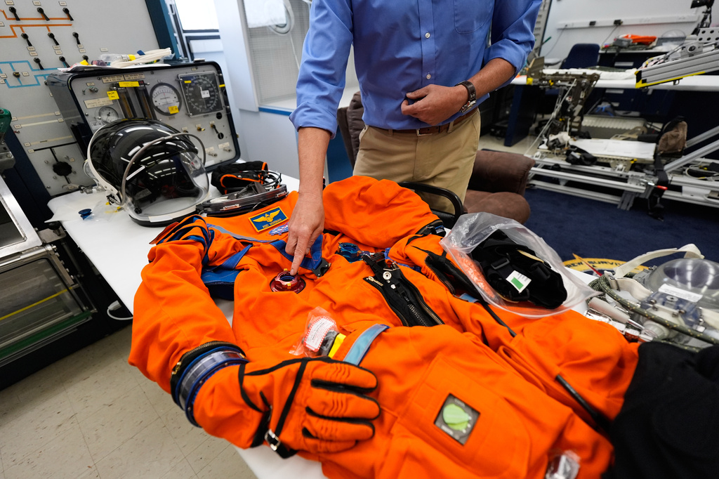 Dustin Gohmert, Orion Crew Survival Systems project manager, describes construction of space suits that will be used for the Artemis II mission at Johnson Space Center on Thursday, July 24, 2025, in Houston. (AP Photo/Ashley Landis)