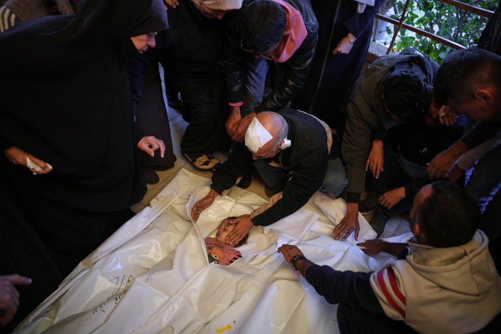 Sabri Abu Sabt bids farewell to his granddaughter, Ayloul, who was killed in an Israeli army strike, during her funeral at Nasser Hospital in Khan Younis, Gaza Strip, on Thursday, Nov. 20, 2025. (AP Photo/Abdel Kareem Hana)