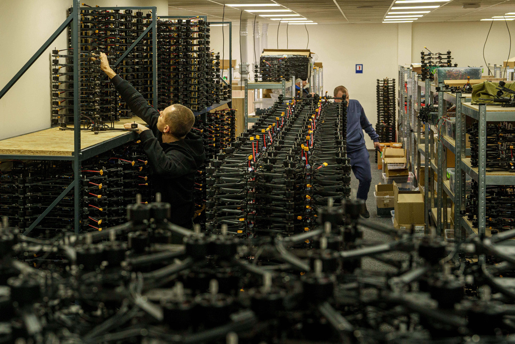An engineer collects FPV drones of "General Cherry" company at the workshop in Ukraine, on Dec. 4, 2025. (AP Photo/Evgeniy Maloletka)