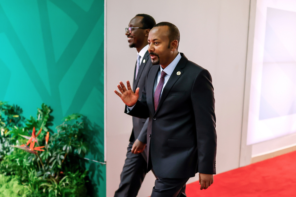 Ethiopia's Prime Minister Abiy Ahmed Ali, foreground, arrives for the second day of the G20 Leaders' Summit, in Johannesburg, South Africa, Sunday, Nov. 23, 2025. (Marco Longari/Pool Photo via AP)