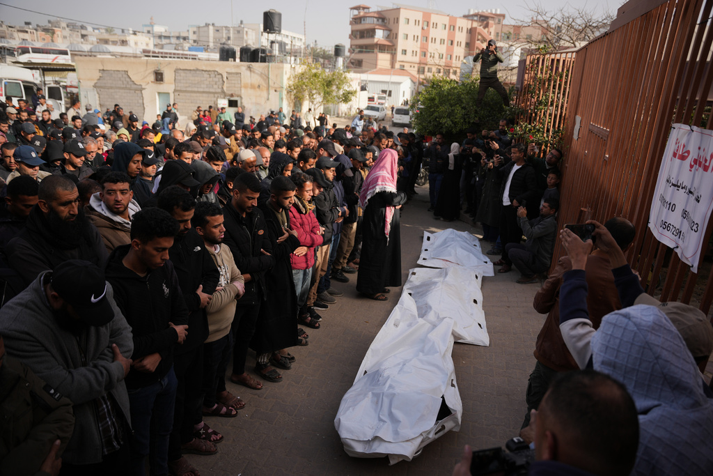 Palestinians perform funeral prayers over the bodies of Hamas militants who were killed in an Israeli military strike, at Nasser Hospital in Khan Younis, Gaza, Sunday, Feb. 15, 2026. (AP Photo/Abdel Kareem Hana)