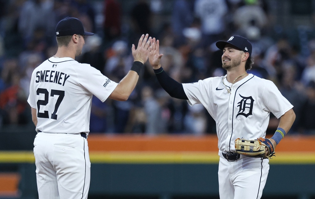 Detroit Tigers' Trey Sweeney, left, celebrates with Zach McKinstry, right, after a win over the Tampa Bay Rays in a baseball game Monday, July 7, 2025, in Detroit. (AP Photo/Duane Burleson)