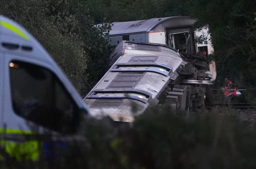 A train with around 150 people aboard derailed near the Lewes, England, railway station in East Sussex on Thursday, Aug. 13, 2026. (Jonathan Brady/PA via AP)