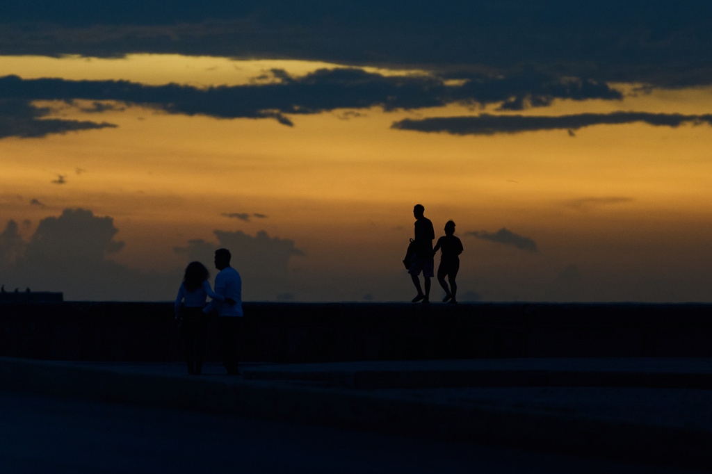 People spend time walking on the Malecón seawall during a blackout in Havana, Cuba, Friday, July 10, 2026. (AP Photo/Ramon Espinosa)