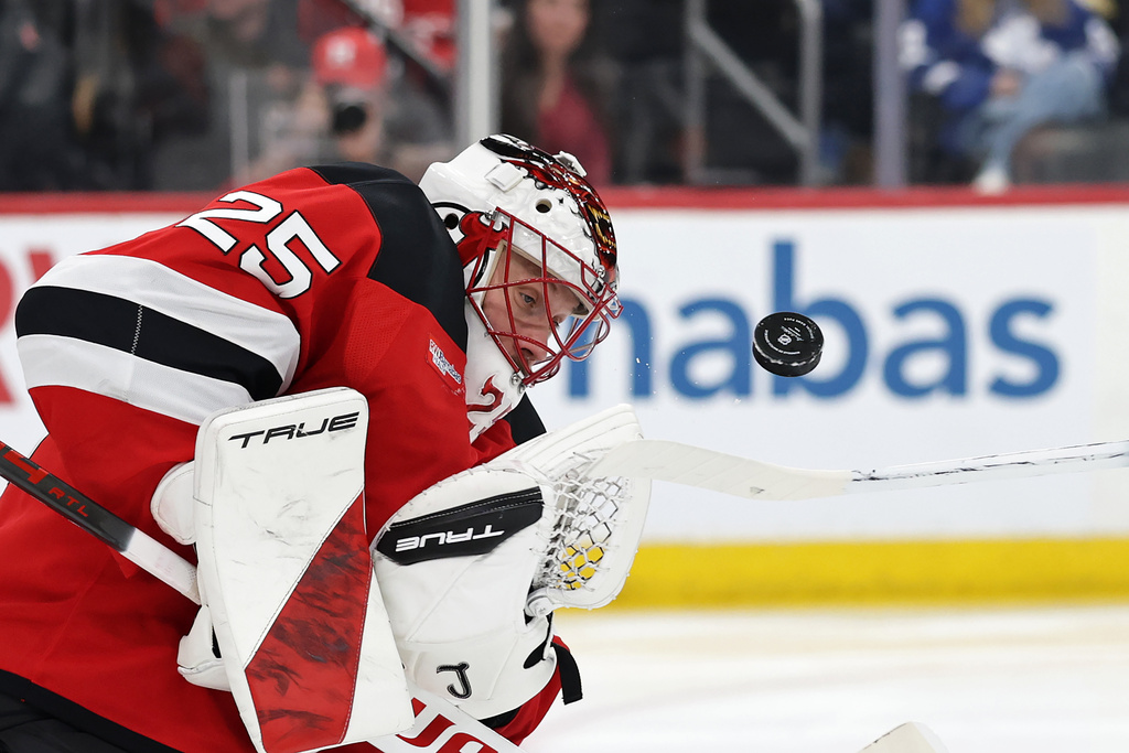 New Jersey Devils goaltender Jacob Markstrom makes a save during the third period of an NHL hockey game against the Toronto Maple Leafs, Wednesday, March 4, 2026, in Newark, N.J. (AP Photo/Adam Hunger)