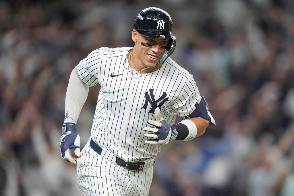 New York Yankees' Aaron Judge reacts as he rounds the bases after hitting a three-run home run against the Toronto Blue Jays during the fourth inning of Game 3 of baseball's American League Division Series, Tuesday, Oct. 7, 2025, in New York. (AP Photo/Frank Franklin II)