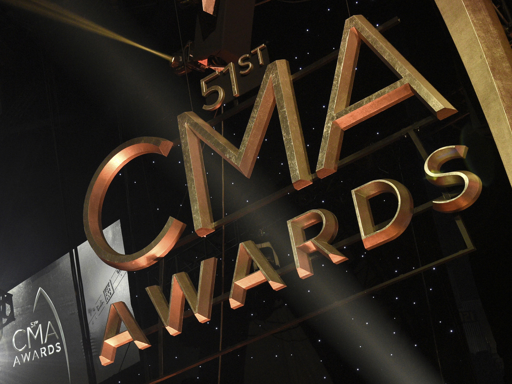 FILE - Signage for the 51st annual CMA Awards appears at the Bridgestone Arena on Nov. 8, 2017, in Nashville, Tenn. (Photo by Chris Pizzello/Invision/AP, File)