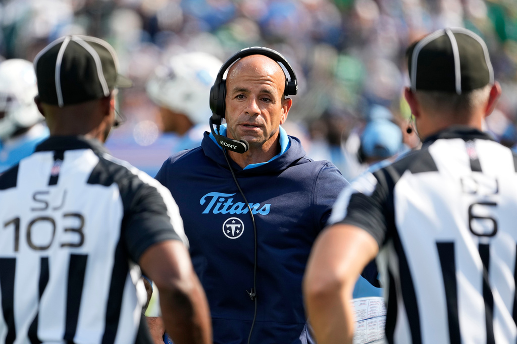 Tennessee Titans head coach Robert Saleh, center, talks with officials during the second half of an NFL football game against the Philadelphia Eagles, Sunday, Sept. 20, 2026, in Nashville, Tenn.(AP Photo/George Walker IV)