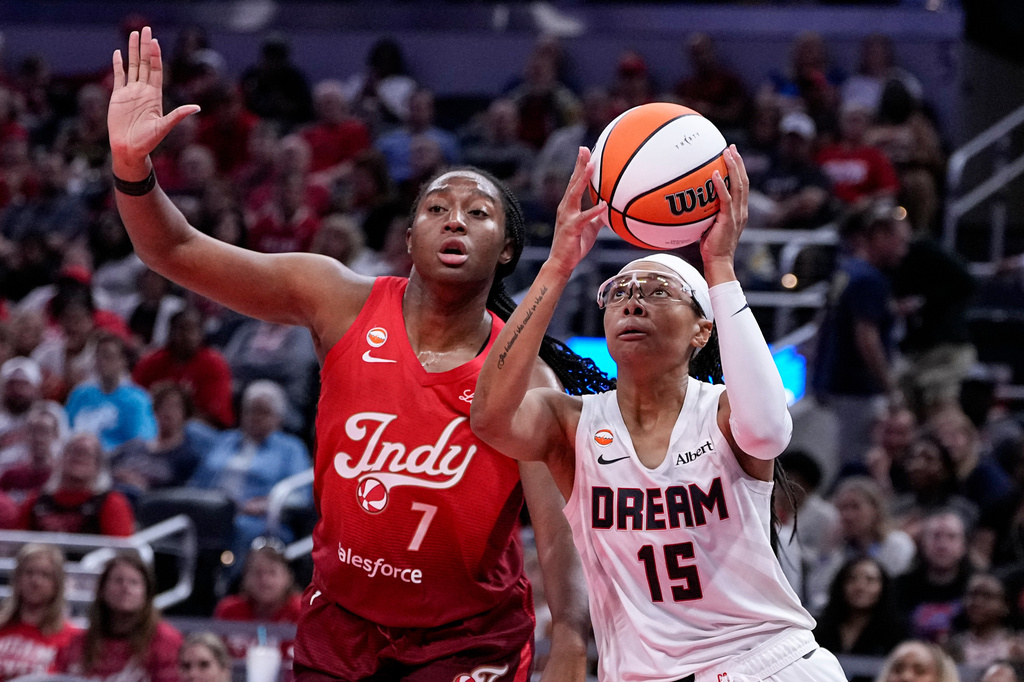 Atlanta Dream guard Allisha Gray (15) looks to shoot in front of Indiana Fever center Aliyah Boston (7) in the second half of a WNBA basketball game in Indianapolis, Thursday, June 18, 2026. (AP Photo/Michael Conroy)