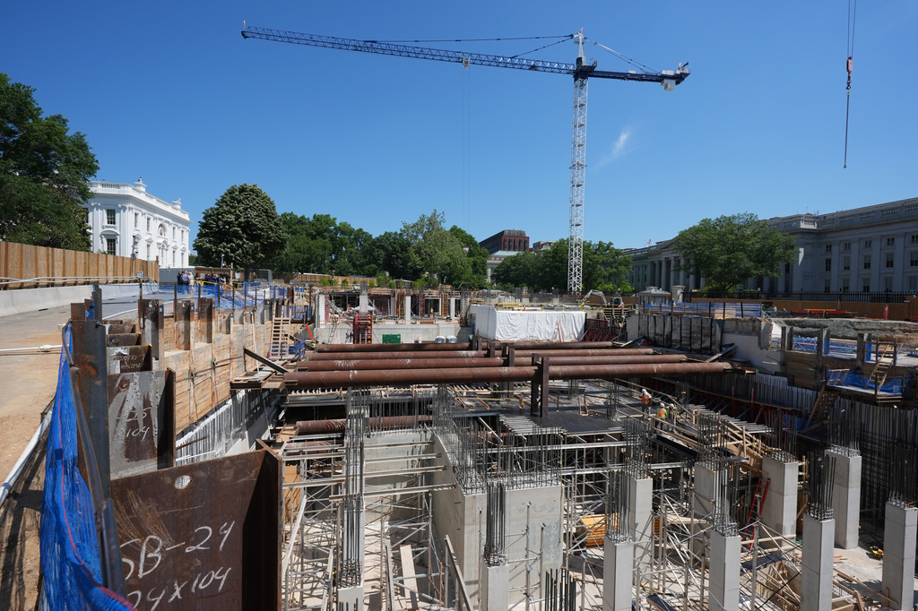The Ballroom construction site can be seen as President Donald Trump tours the area at the White House, Tuesday, May 19, 2026, in Washington. (AP Photo/Jacquelyn Martin)