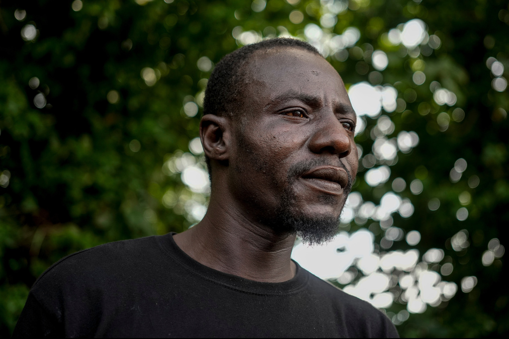Harounat Sarre, a Mauritanian immigrant, pauses in the parking lot of Touba Tedoungal African restaurant in Lockland, Ohio, Friday, July 31, 2026. (AP Photo/Carolyn Kaster)