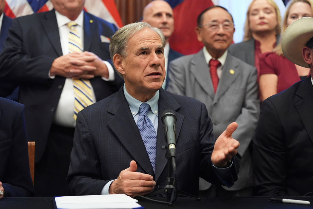 FILE - Texas Gov. Greg Abbott speaks to the media following a bill signing as Texas senators debate a bill on a redrawn U.S. congressional map during a special session in the Senate Chamber at the Texas Capitol in Austin, Texas, Aug. 22, 2025. (AP Photo/Eric Gay, File)