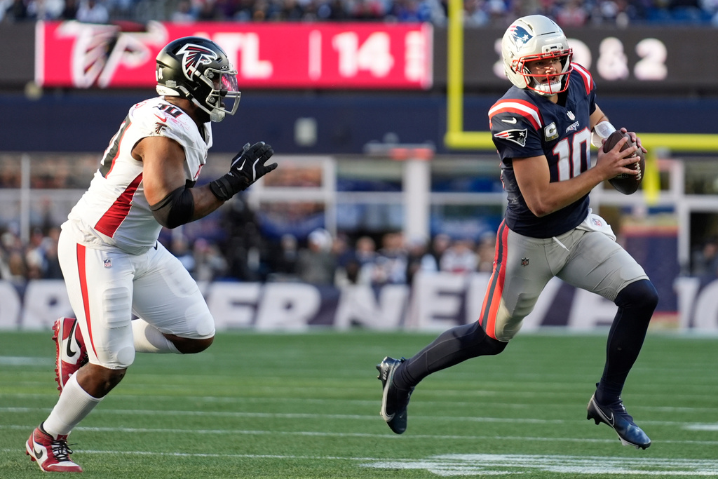 New England Patriots quarterback Drake Maye (10) runs against the Atlanta Falcons during the second half of an NFL football game, Sunday, Nov. 2, 2025, in Foxborough, Mass. (AP Photo/Robert F. Bukaty)