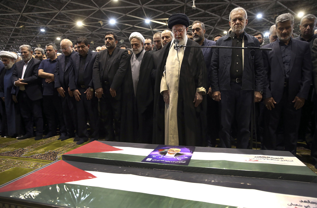 FILE - In this photo released by the official website of the office of the Iranian supreme leader, Supreme Leader Ayatollah Ali Khamenei, third right, leads a prayer over the coffins of Hamas leader Ismail Haniyeh and his bodyguard who were killed in an assassination blamed on Israel on Wednesday, during their funeral ceremony at the Tehran University campus, in Tehran, Iran, Aug. 1, 2024. (Office of the Iranian Supreme Leader via AP, File)