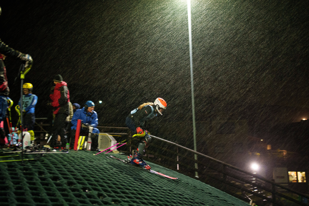 Heavy rain falls as a skier competes in a slalom race during an inter-club ski meeting at Pendle Ski Club in Clitheroe, England, Tuesday, Oct. 28, 2025. (AP Photo/Jon Super).