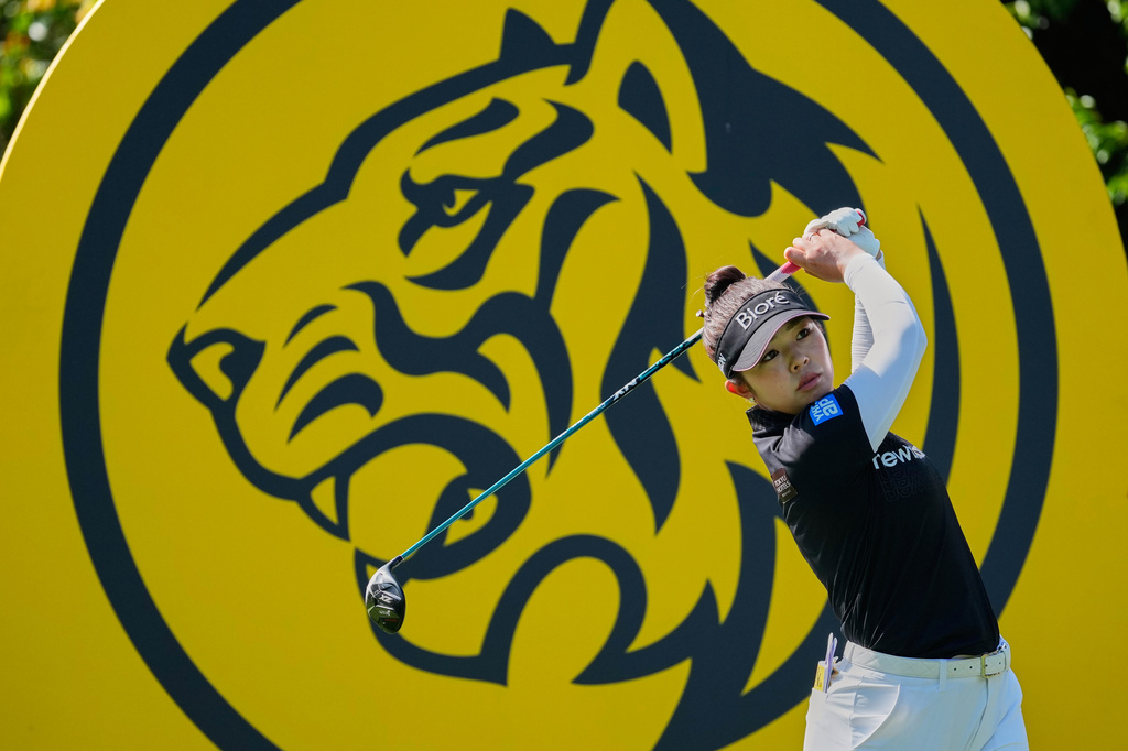 Miyu Yamashita of Japan watches a ball on the 3rd hole during the second day of LPGA Maybank Championship in Kuala Lumpur, Malaysia, Friday, Oct. 30, 2026. (AP Photo/Vincent Thian)
