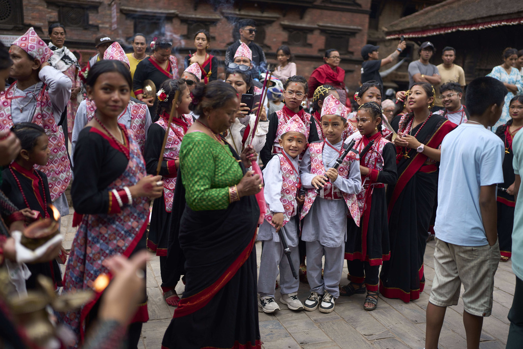 Hindu devotees participate in a parade celebrating the birthday of Lord Krishna on Krishna Janmashtami in Bhaktapur,Nepal, Saturday, Aug. 16, 2025. (AP Photo/Niranjan Shrestha)