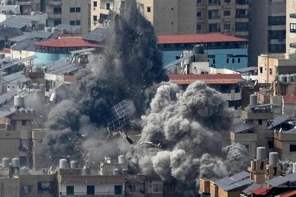 Smoke rises following an Israeli airstrike in Dahiyeh, Beirut's southern suburbs, in Beirut, Lebanon, Friday, March 6, 2026. (AP Photo/Hussein Malla)