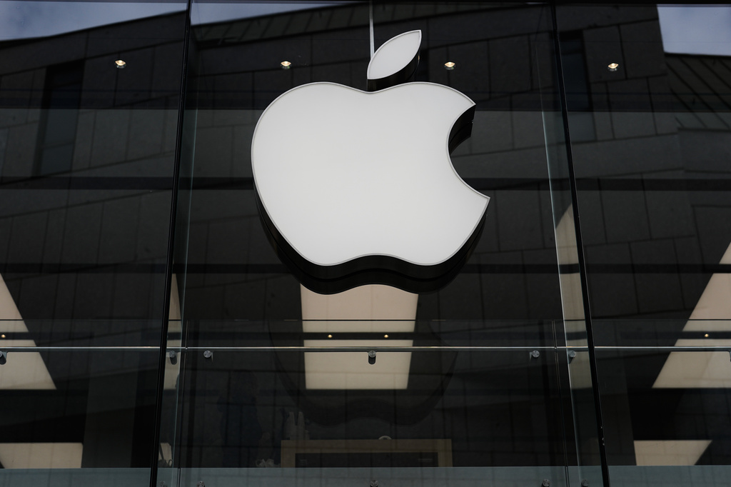FILE - The Apple logo is illuminated at a store in Munich, Germany, April 2, 2026. (AP Photo/Matthias Schrader, File)