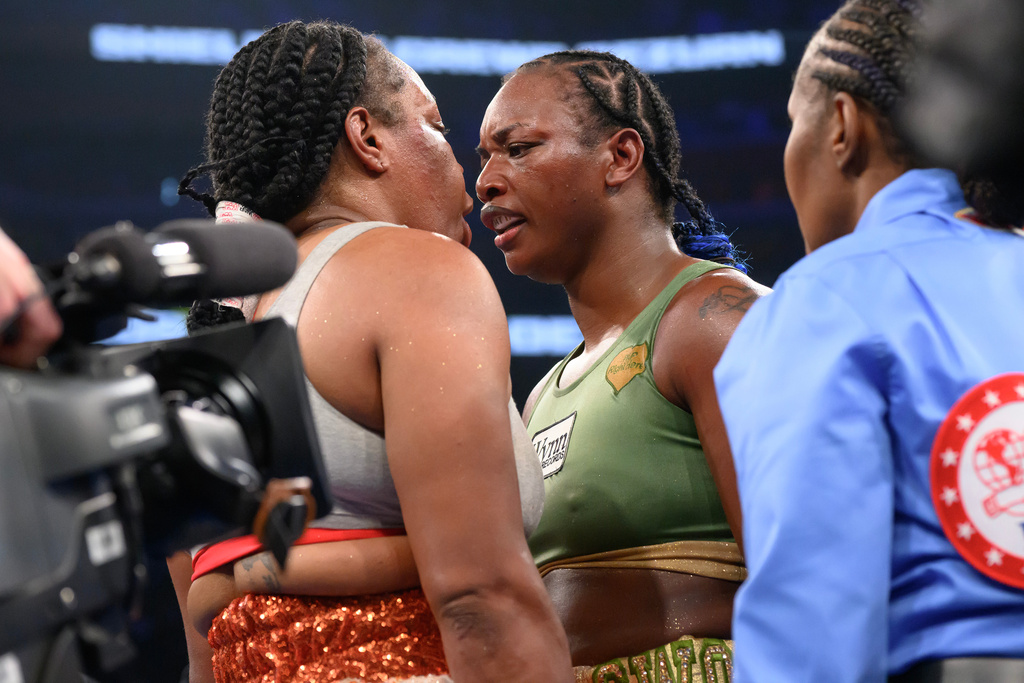 Claressa Shields, right, exchanges words with Franchon Crews-Dezurn after their Undisputed Heavyweight World Championship boxing match, Sunday, Feb. 22, 2026, in Detroit. (AP Photo/Lon Horwedel)