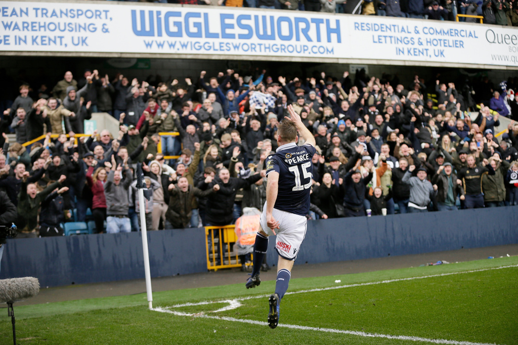 FILE - Millwall's Alex Pearce celebrates after scoring a goal during the English FA Cup quarterfinal between Millwall and Brighton & Hove Albion at The Den in London, Sunday March 17, 2018. (AP Photo/Tim Ireland, file)