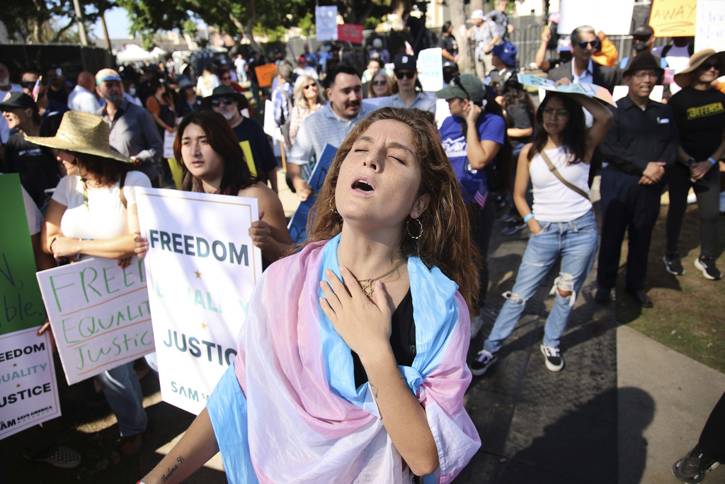 Supporters gather during an immigration rally on Saturday, Sept. 20, 2025, in Los Angeles. (AP Photo/Ethan Swope)