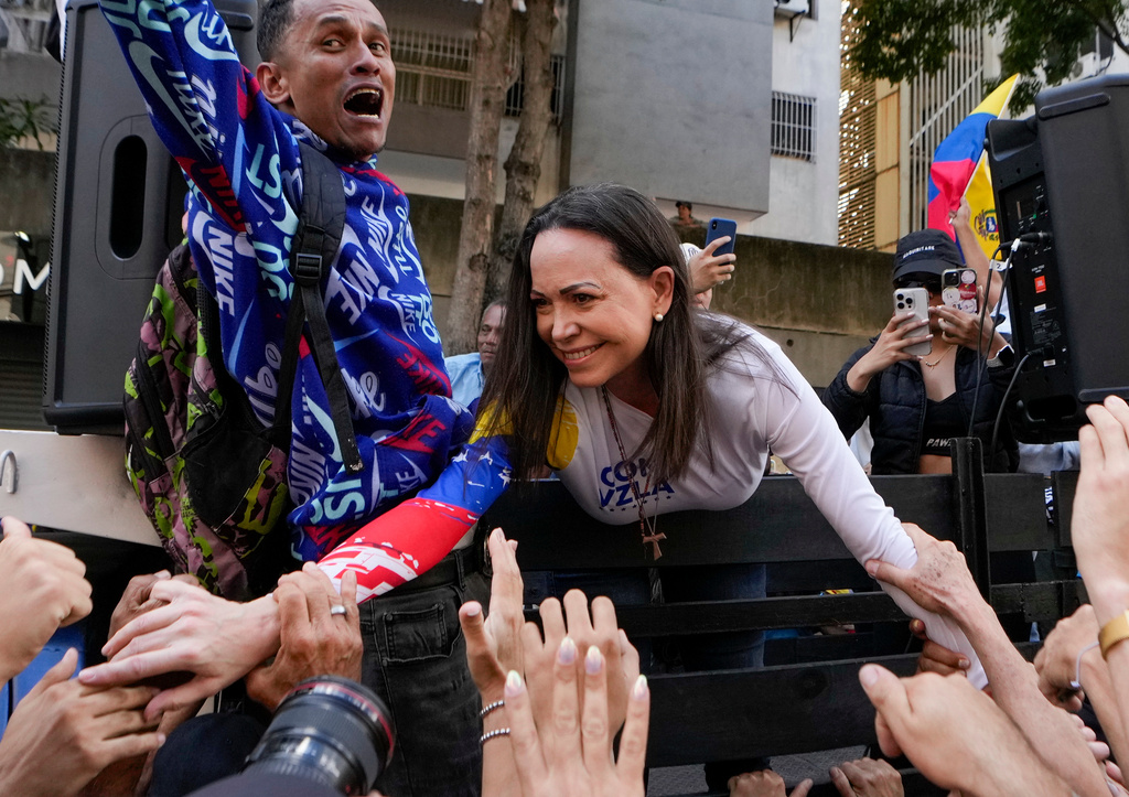 FILE - Opposition leader Maria Corina Machado greets supporters during a protest against Venezuelan President Nicolas Maduro the day before his inauguration for a third term in Caracas, Venezuela, Thursday, Jan. 9, 2025. (AP Photo/Matias Delacroix, file)