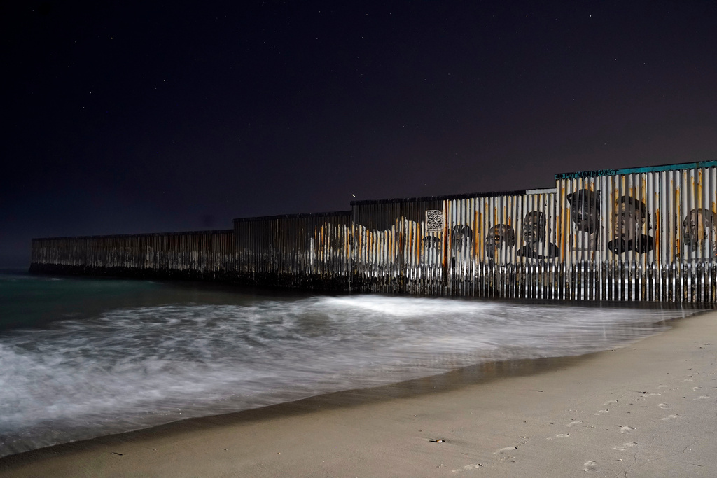 FILE - The border fence ends at the Pacific Ocean, Dec. 20, 2022, in Tijuana, Mexico. (AP Photo/Marcio Jose Sanchez, File)