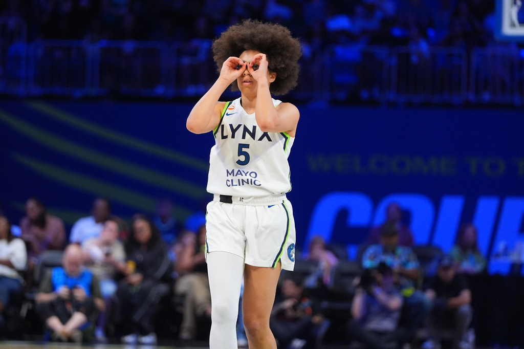 Minnesota Lynx guard Olivia Miles gestures after her team scored during the second half of a WNBA basketball game against the Dallas Wings in Arlington, Texas, Sunday, June 28, 2026. (AP Photo/LM Otero)