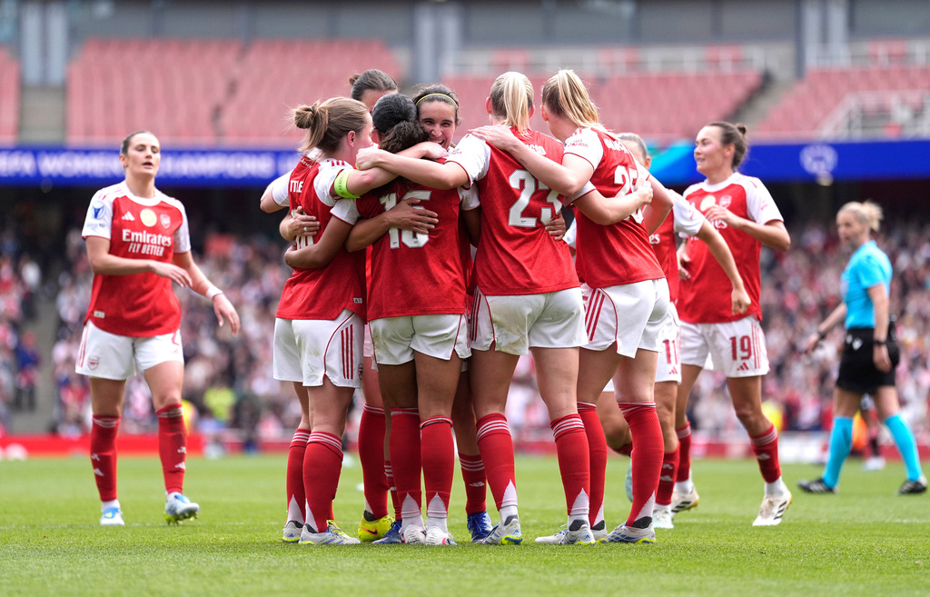 Arsenal's players celebrate their side's second goal scored by Olivia Smith during the Women's Champions League semi-final, first leg soccer match between Arsenal and OL Lyonnes in London, England, Sunday, April 26, 2026. (Andrew Matthews/PA via AP)