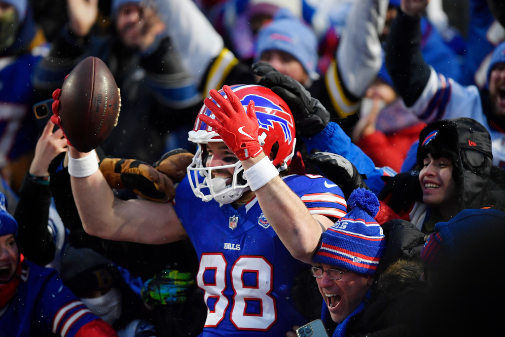 Buffalo Bills tight end Dawson Knox (88) celebrates after scoring a touchdown against the New York Jets in the first half of an NFL football game Sunday, Jan. 4, 2026, in Orchard Park, N.Y. (AP Photo/Adrian Kraus)