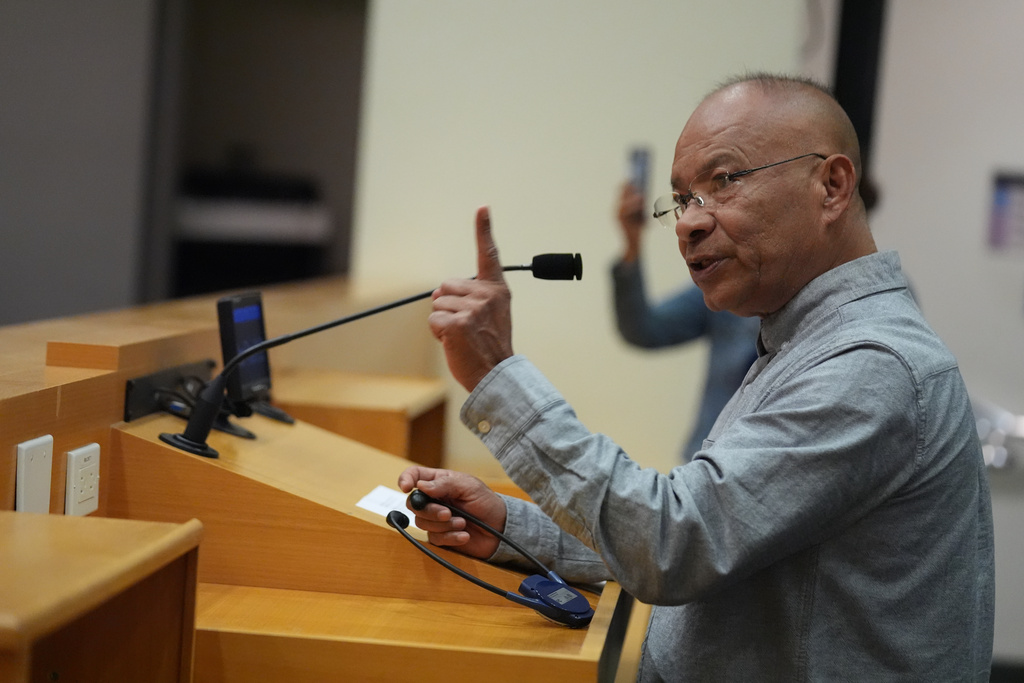 Parent Juan Magnani questions Los Angeles Unified School District board members during a public comments meeting at LAUSD headquarters before the board held a special closed session with Superintendent Alberto Carvalho, Thursday, Feb. 26, 2026, in Los Angeles. (AP Photo/Damian Dovarganes)