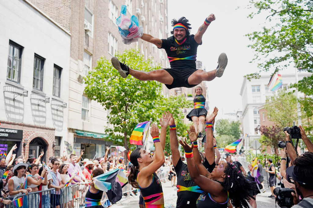 FILE - Members of Gotham Cheer perform during the NYC Pride March on June 29, 2025, in New York. (Photo by Charles Sykes/Invision/AP, file)