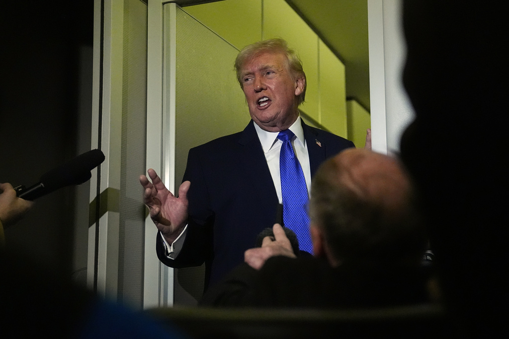 President Donald Trump speaks with reporters aboard Air Force One, Monday, Feb. 16, 2026, en route to Washington from West Palm Beach, Fla. (AP Photo/Matt Rourke)