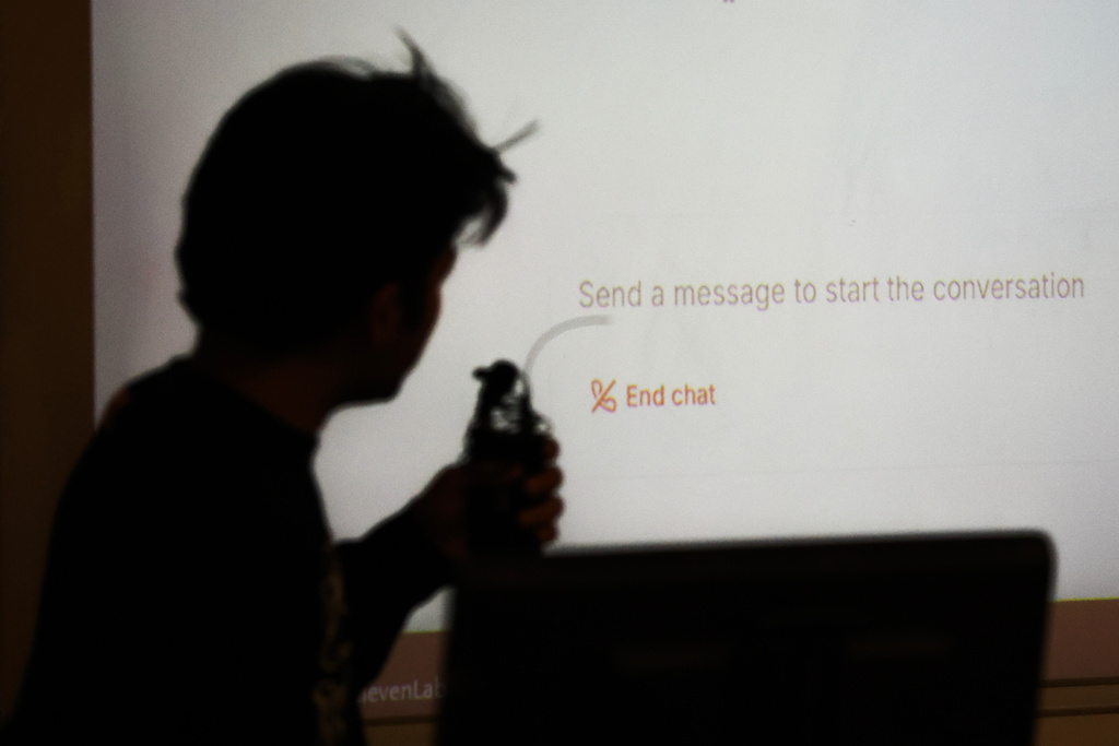 Student Surya Newa is silhouetted while using an oral AI agent during class at NYU Stern School of Business, March 4, 2026, in New York. (AP Photo/Heather Khalifa)