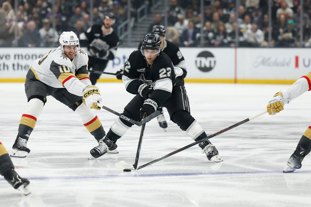 Vegas Golden Knights center Colton Sissons (10), Los Angeles Kings left wing Kevin Fiala (22) and Vegas Golden Knights defenseman Zach Whitecloud (2) fight for possession of the puck during the second period of an NHL hockey game Wednesday, Jan. 14, 2026, in Los Angeles. (AP Photo/Caroline Brehman)