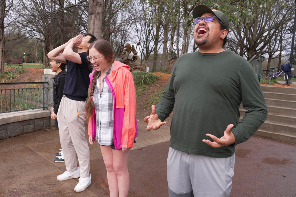 People participate in a Scream Club meeting at Piedmont Park, Sunday, March 8, 2026, in Atlanta. (AP Photo/Emilie Megnien)