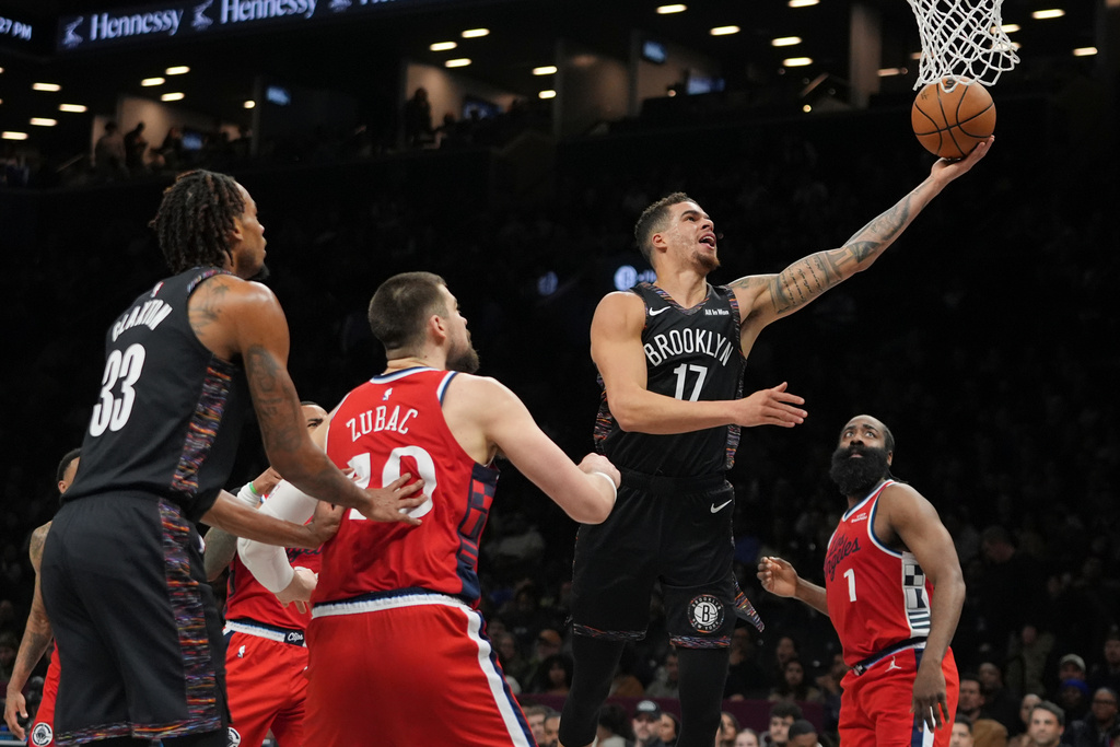Brooklyn Nets' Michael Porter Jr. (17) drives past LA Clippers' James Harden (1) and Ivica Zubac (40) during the first half of an NBA basketball game Friday, Jan. 9, 2026, in New York. (AP Photo/Frank Franklin II)
