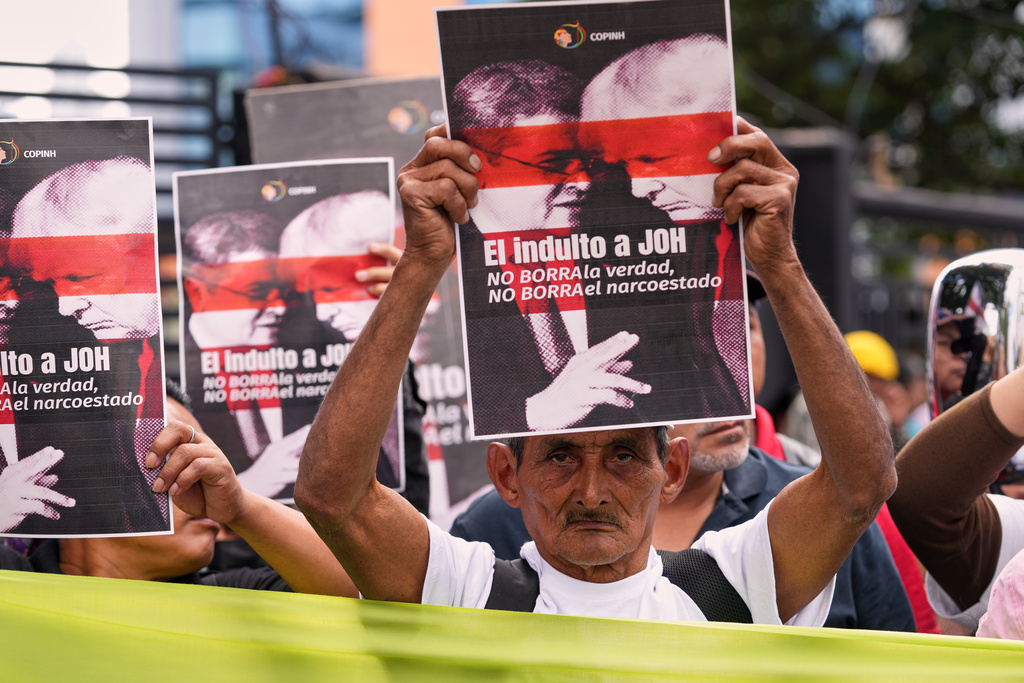Farmers protest against President Donald Trump's pardon of Honduras' former President Juan Orlando Hernandez in Tegucigalpa, Honduras, Thursday, Dec. 4, 2025. (AP Photo/Moises Castillo)