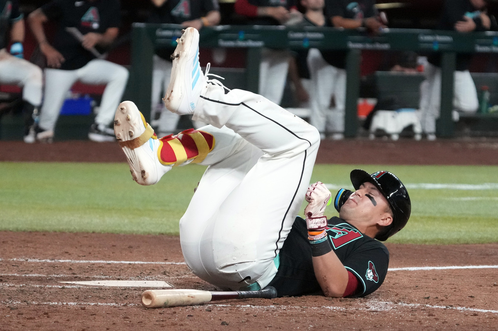 Arizona Diamondbacks' Lars Nootbaar reacts after a foul ball in the sixth inning of a baseball game against the Los Angeles Dodgers, Saturday, Aug 8, 2026, in Phoenix. (AP Photo/Rick Scuteri)
