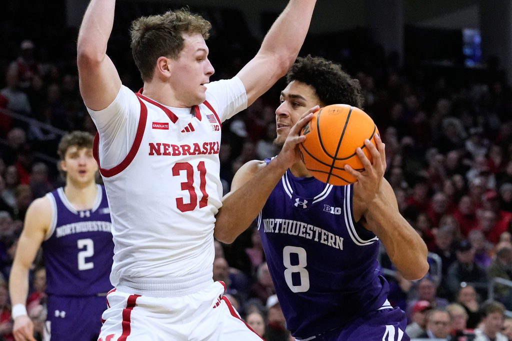 Northwestern forward Tre Singleton (8) drives with the ball as Nebraska guard Cale Jacobsen (31) defends during the second half of an NCAA college basketball game in Evanston, Ill., Saturday, Jan. 17, 2026. (AP Photo/Nam Y. Huh)