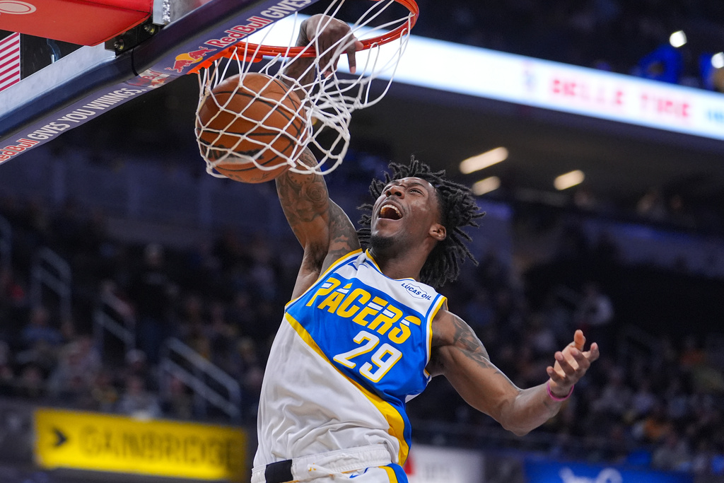 Indiana Pacers guard Quenton Jackson (29) gets a dunk against the Utah Jazz during the second half of an NBA basketball game in Indianapolis, Tuesday, Feb. 3, 2026. (AP Photo/Michael Conroy)