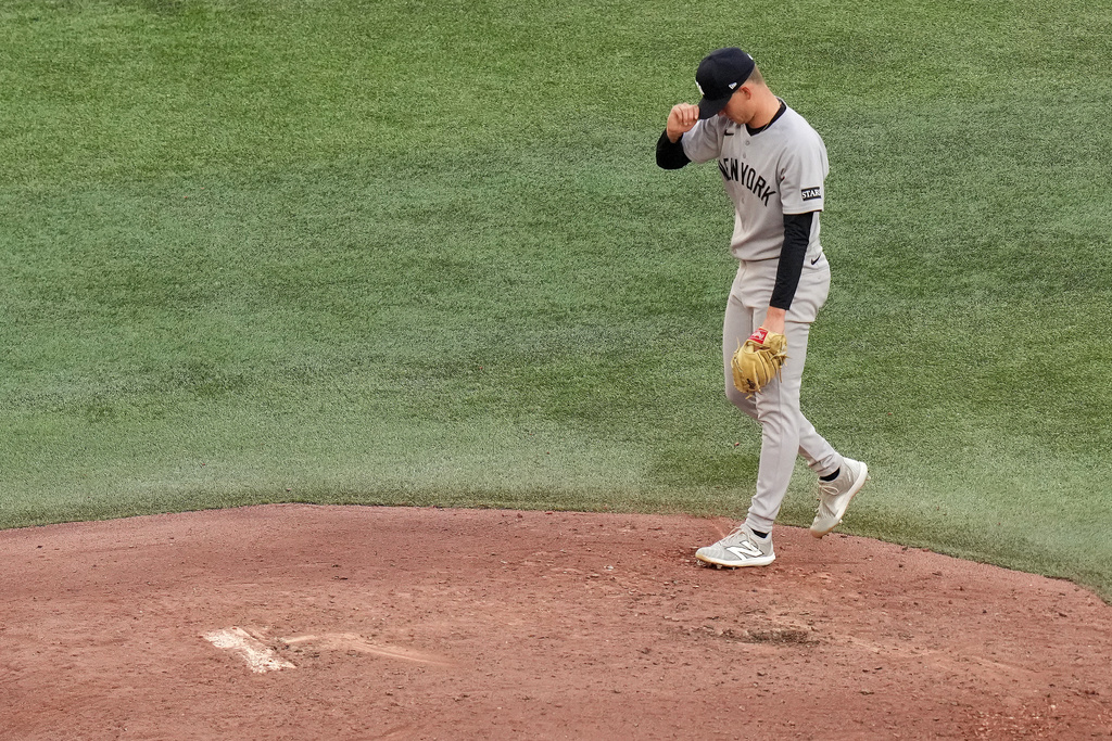 New York Yankees pitcher Will Warren reacts after allowing a two-run home run to Toronto Blue Jays' Daulton Varsho during the fourth inning of Game 2 of baseball's American League Division Series in Toronto, Sunday, Oct. 5, 2025. (Chris Young/The Canadian Press via AP)