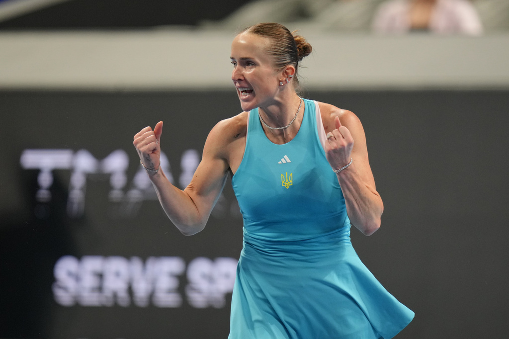 Elina Svitolina of Ukraine celebrates winning her match against Jasmine Paolini of Italy in the Billie Jean King Cup women's singles semifinal between Ukraine and Italy, in Shenzhen, China, Saturday, Sept. 26, 2026. (AP Photo/Andy Wong)