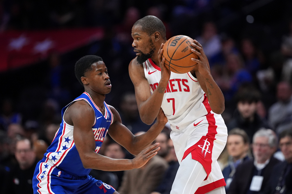 Houston Rockets' Kevin Durant, right, tries to get past Philadelphia 76ers' VJ Edgecombe during the first half of an NBA basketball game Thursday, Jan. 22, 2026, in Philadelphia. (AP Photo/Matt Slocum)